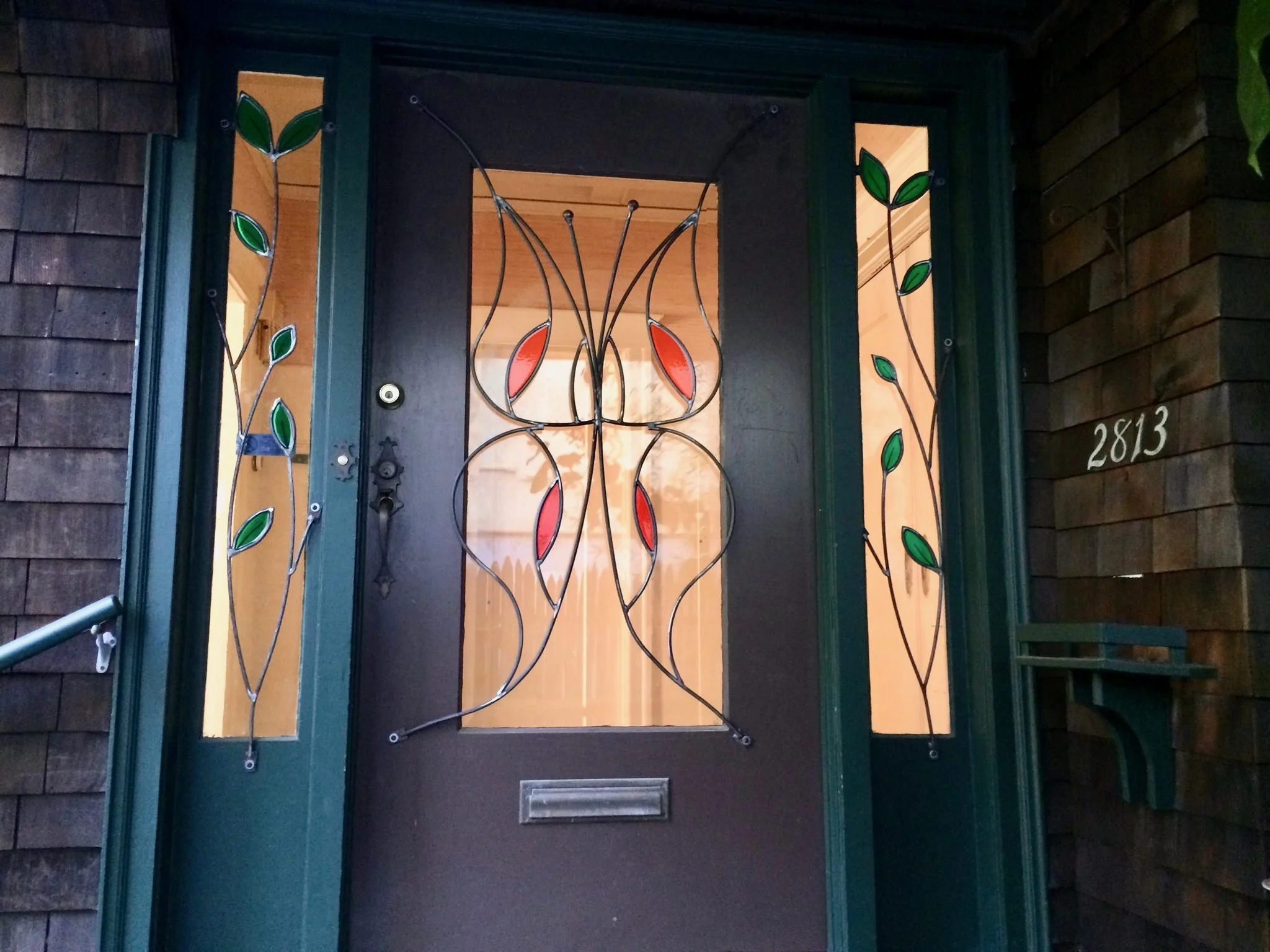 Butterfly Window Guard This custom window guard adds en elegant touch to this Berkeley home, while providing security. It is constructed from bent steel rod, with cast-resin accents.