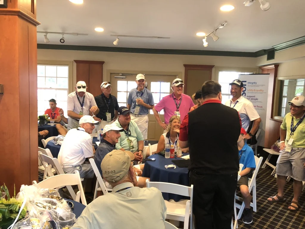Mike entertains Emerson guests during the 20198 PGA Championship at Bellerive.
