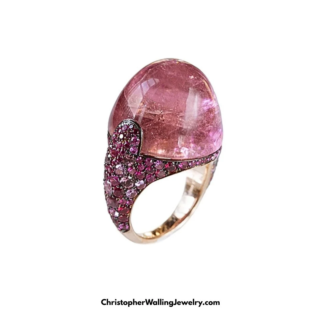What better way to honor one of October's two Birthstones? I love "high-dome" cabochons and here's a spectacular example: a 14 mm high Pink Tourmaline of approximately 40 cts, surrounded with a pav&eacute; of Pink Sapphires!

By appointment