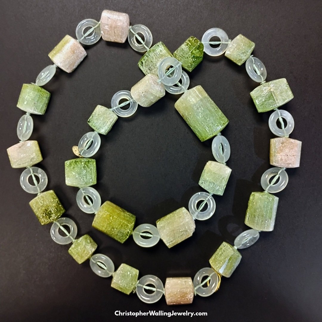 Tourmaline (One of October's Birthstones for only four more days!) crystals and Jade rings necklace. It's particularly unusual as I have rarely seen Bi-color Tourmalines which are Green and...WHITE!.

Jade Circles: 18.5 mm
Tourmalines: 271.8 gr (1,35