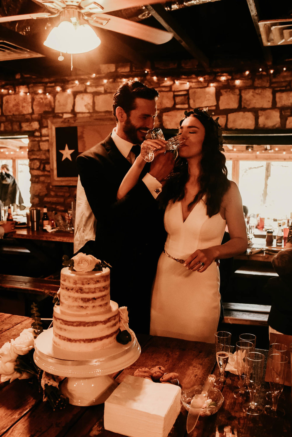 Intimate wedding toast at the salt lick in Austin, Texas