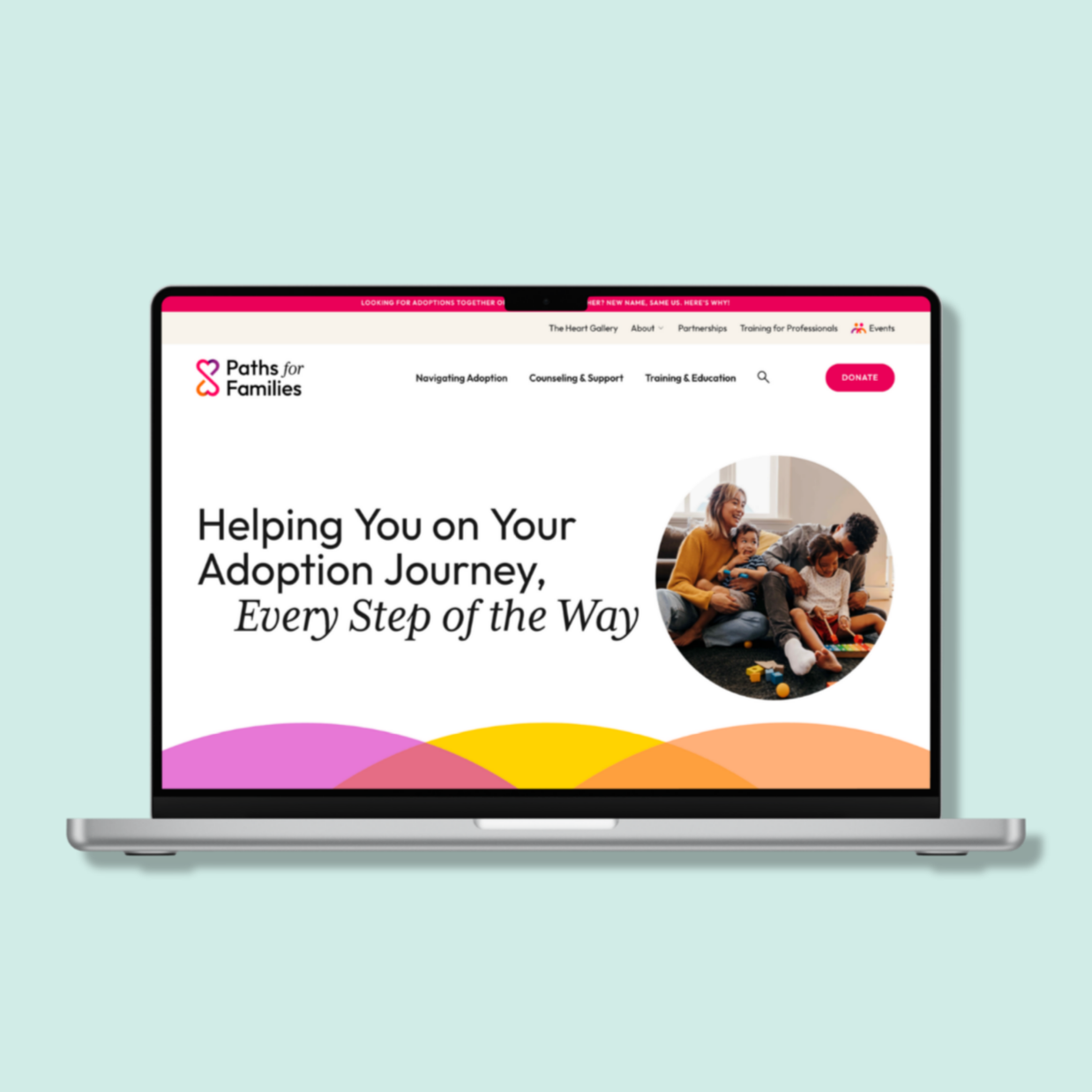 A laptop screen is open to the homepage of Paths for Families' website