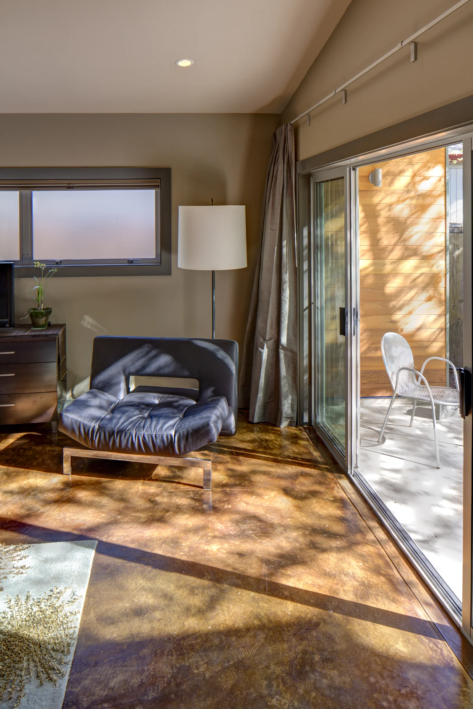 Light-Filled Living Space with Stained Concrete Floors