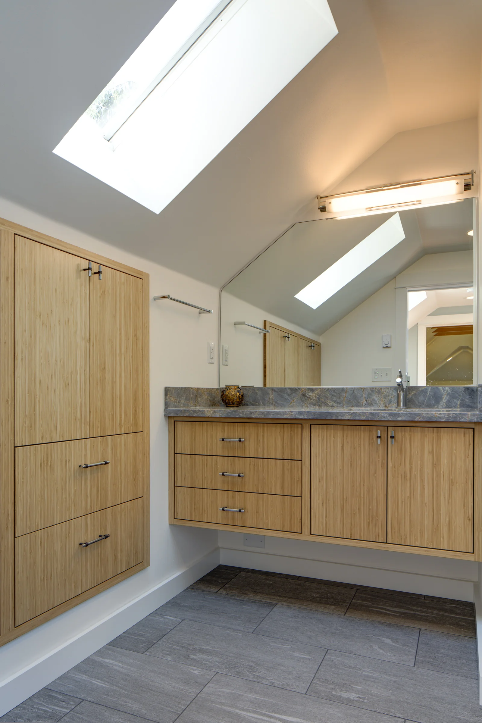 Floating Vanity and Frameless Mirror Expand the Space