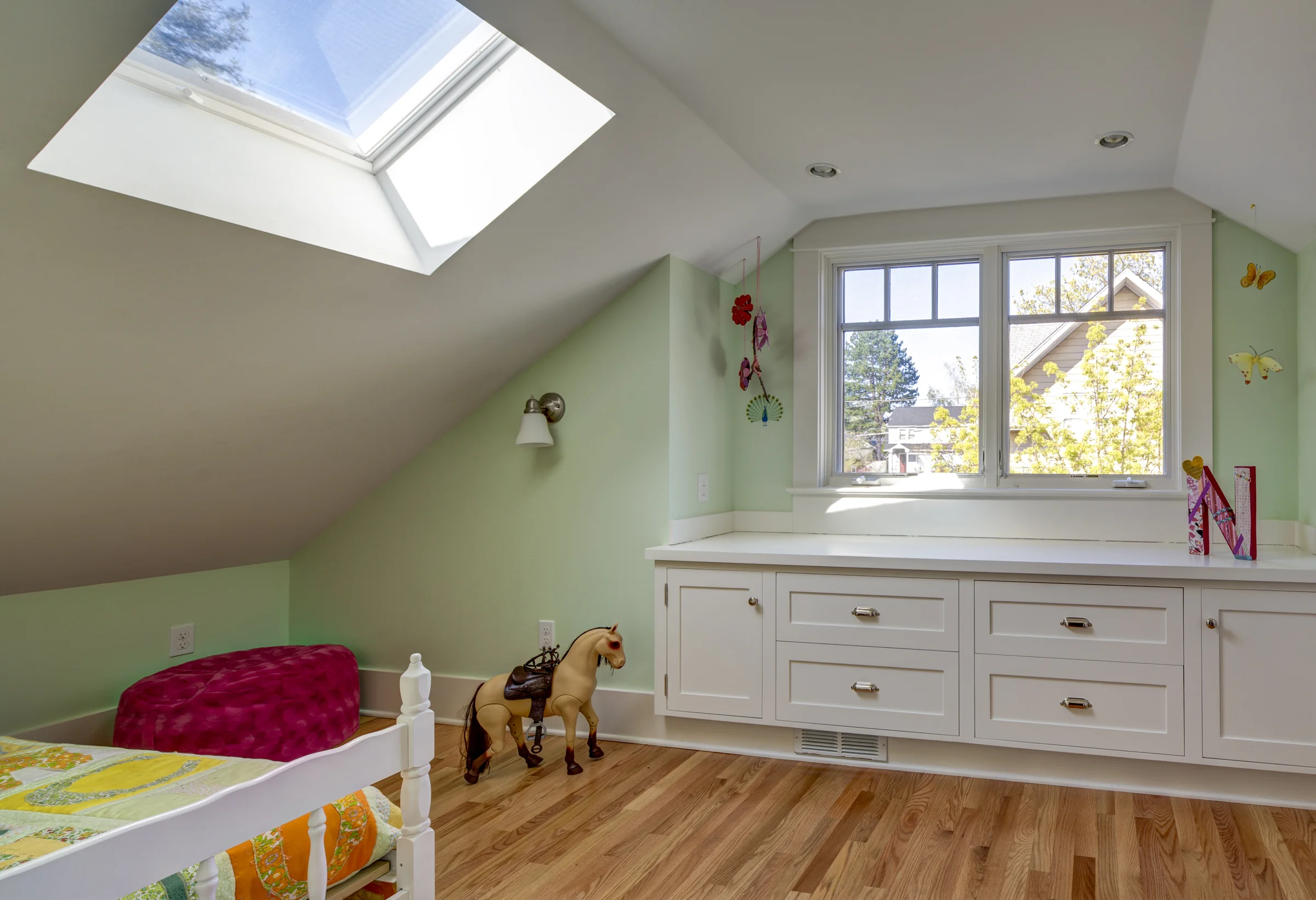 Cozy Bedroom Includes Built-In Dresser and Window Seat