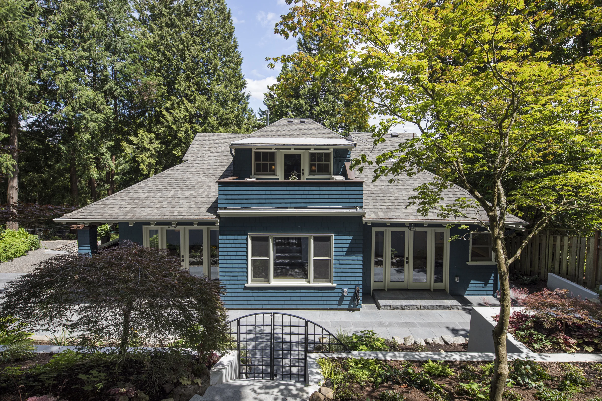 Addition Opens to Terraced Patio on Hillside
