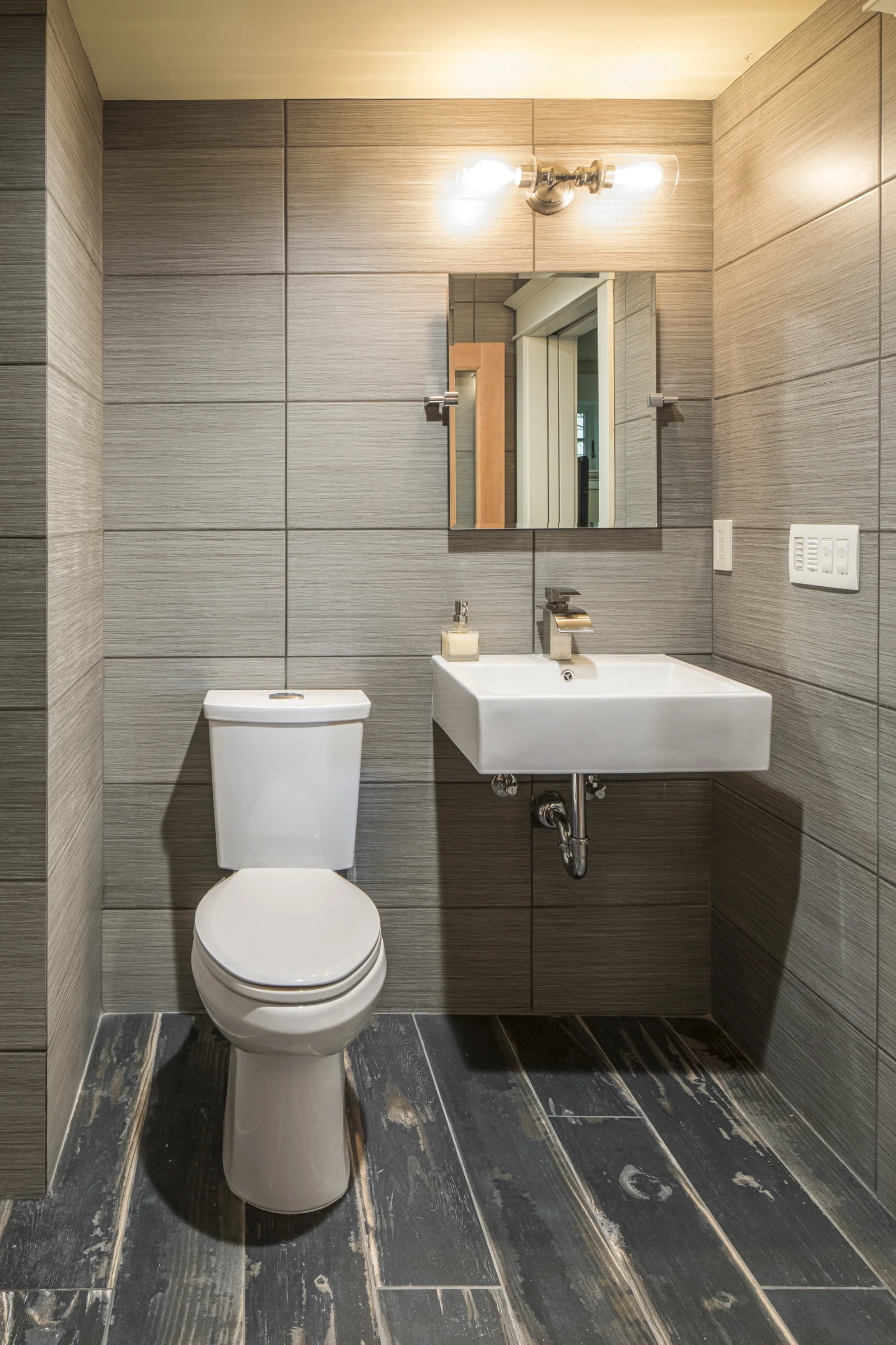 Basement Bathroom with Full Height Tile Walls