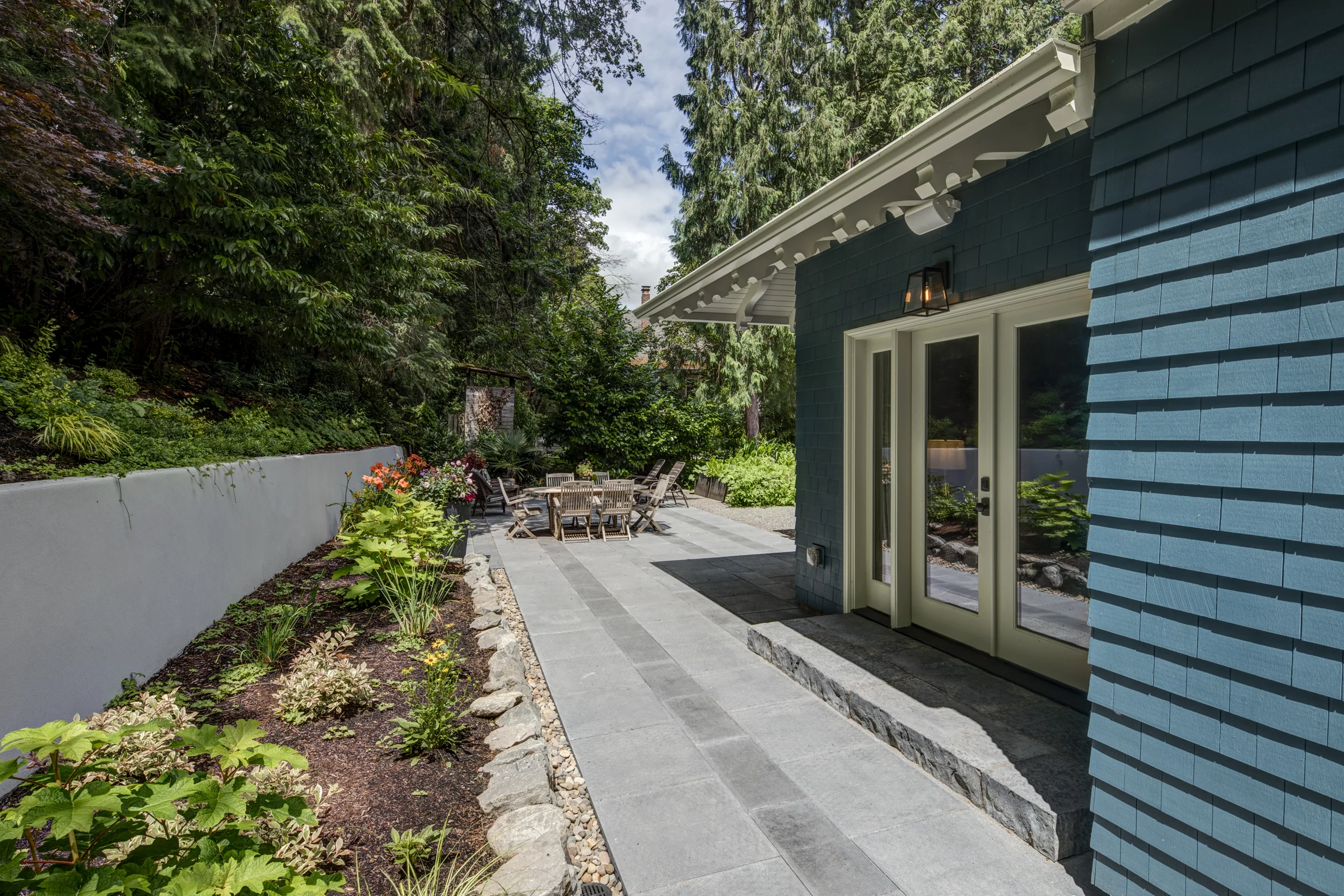 Addition Opens to Terraced Patio on Hillside