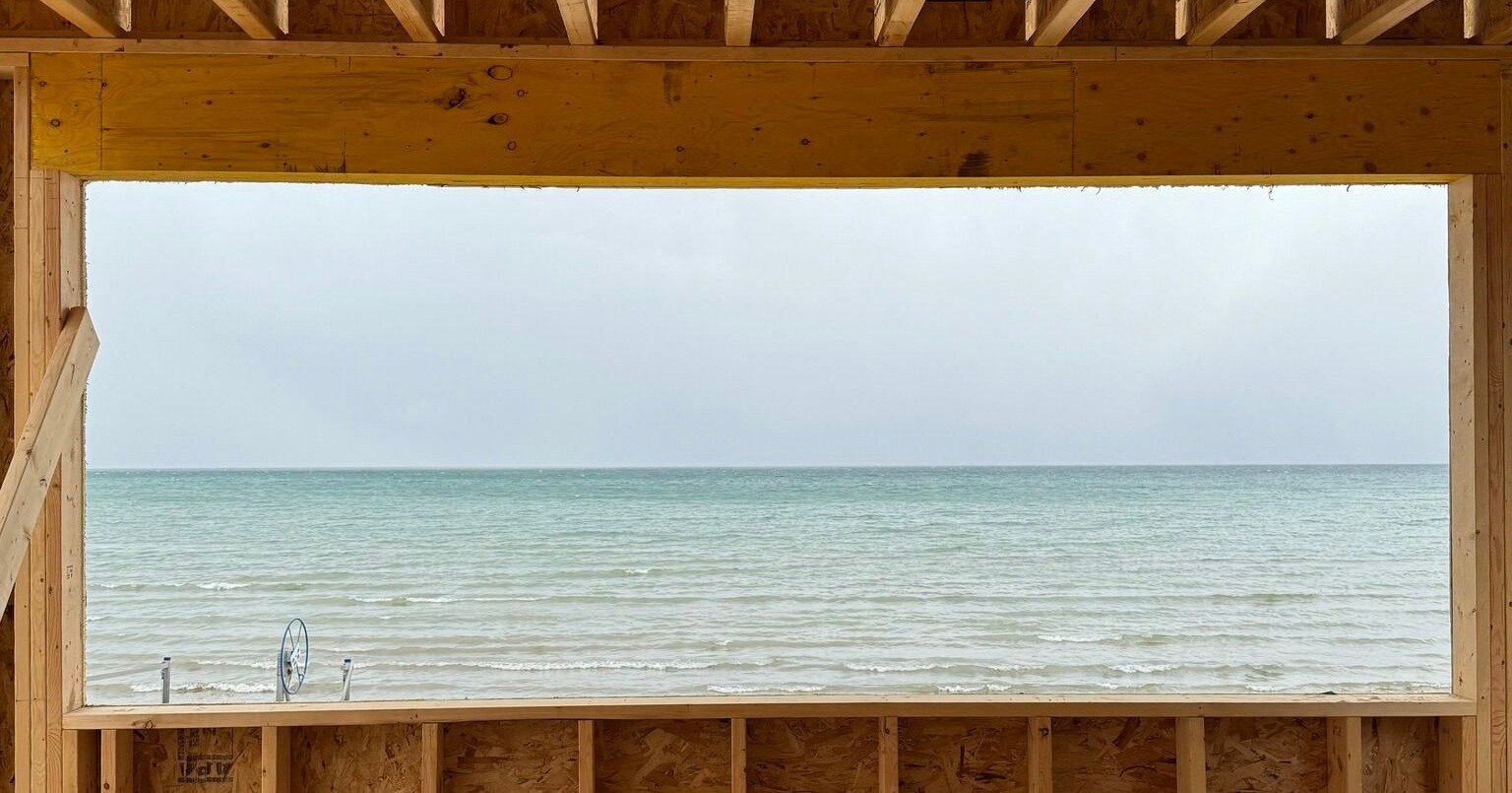 🪜Framing is underway! The best part of designing and building on the water is appreciating the views. This kitchen opening will make one feel like they are on the water while having breakfast on the Island. 🏝️ That horizon line couldn't get any bet