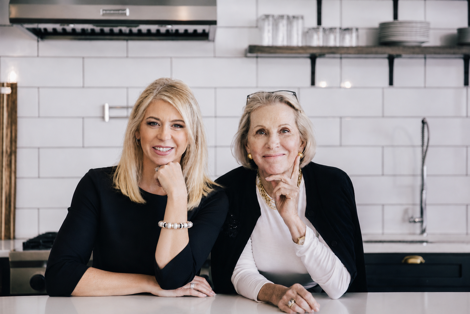 Two women sitting at a kitchen counter