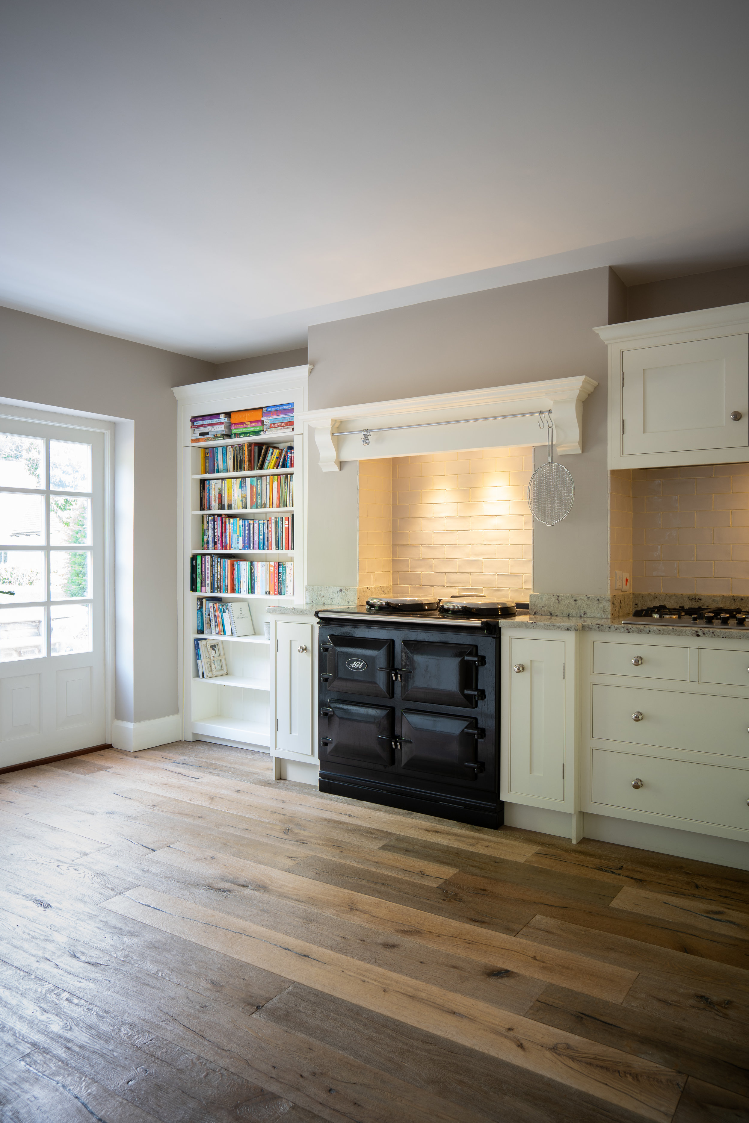 Black Aga Bookcase Floorboards.jpg