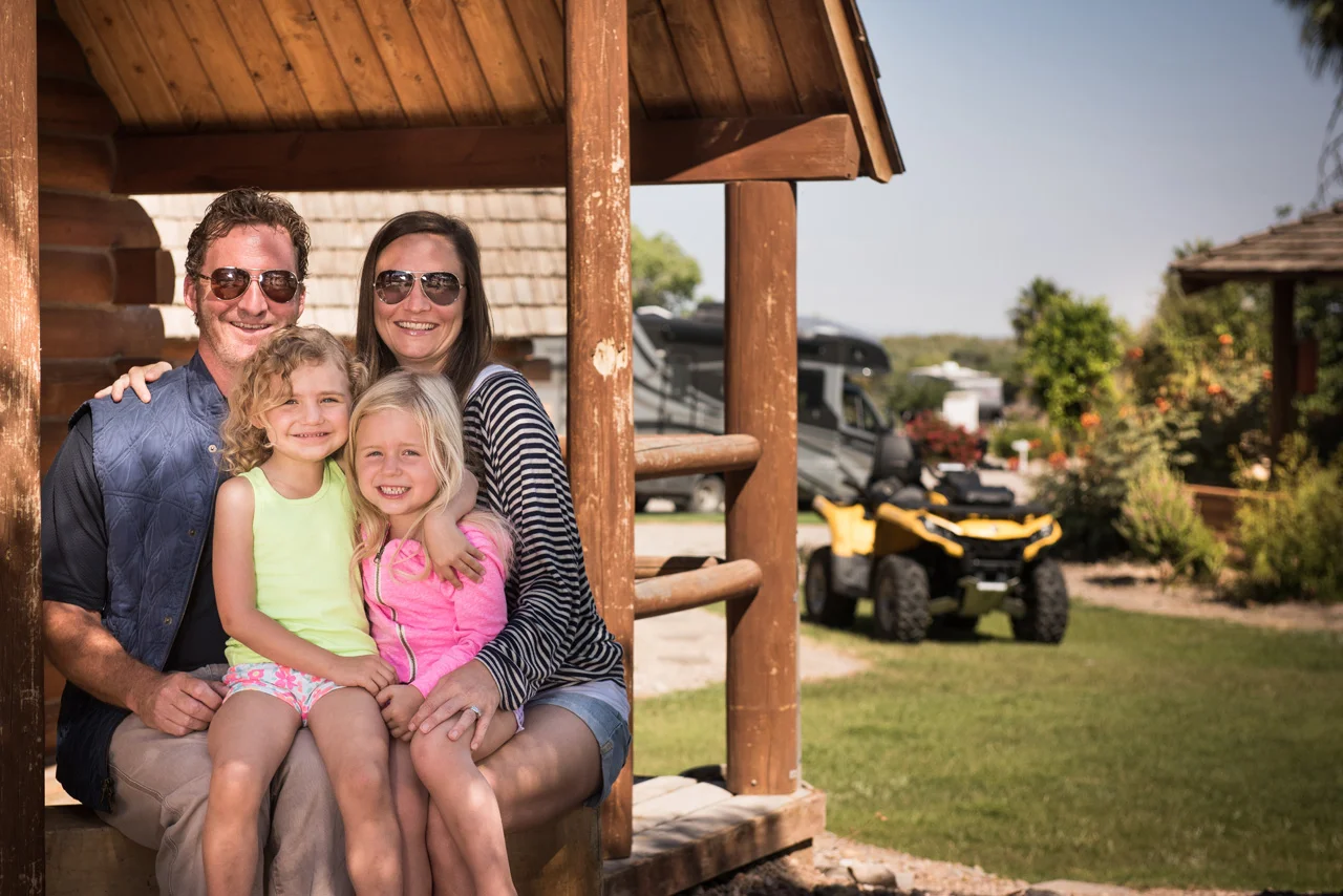 Family in front of cabin at Arizona Oasis.jpg