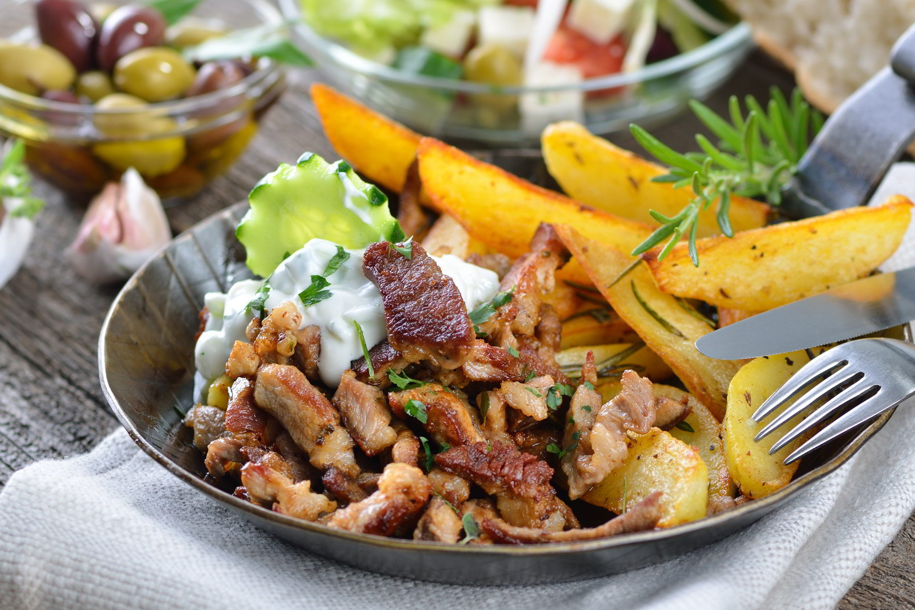 greek-pork-gyros-with-fried-potatoes-and-sauce.jpg