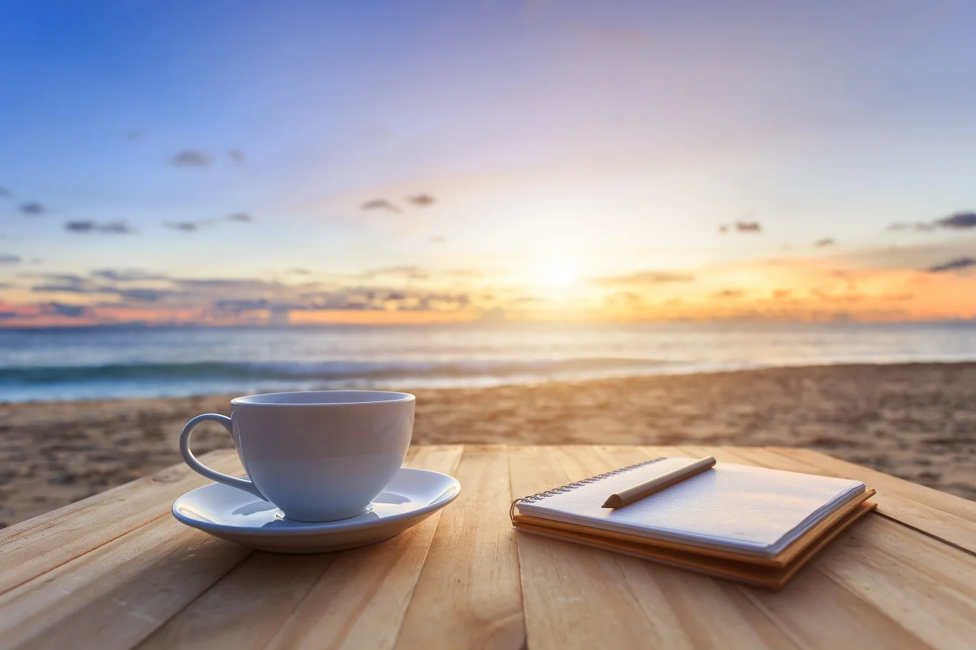 bigstock-Coffee-Cup-On-Wood-Table-At-Su-93388991.jpg