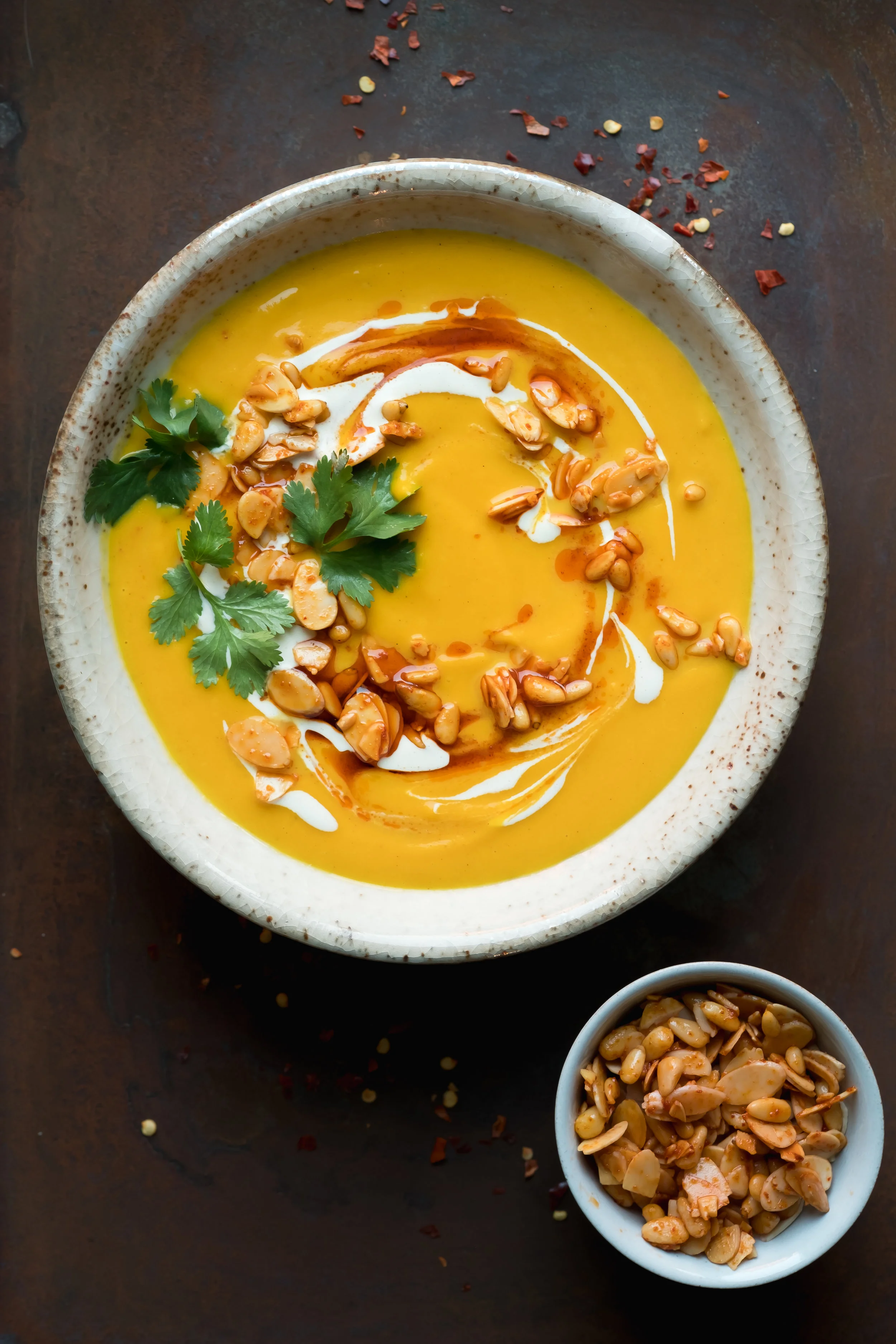 Squash soup with red curry nuts