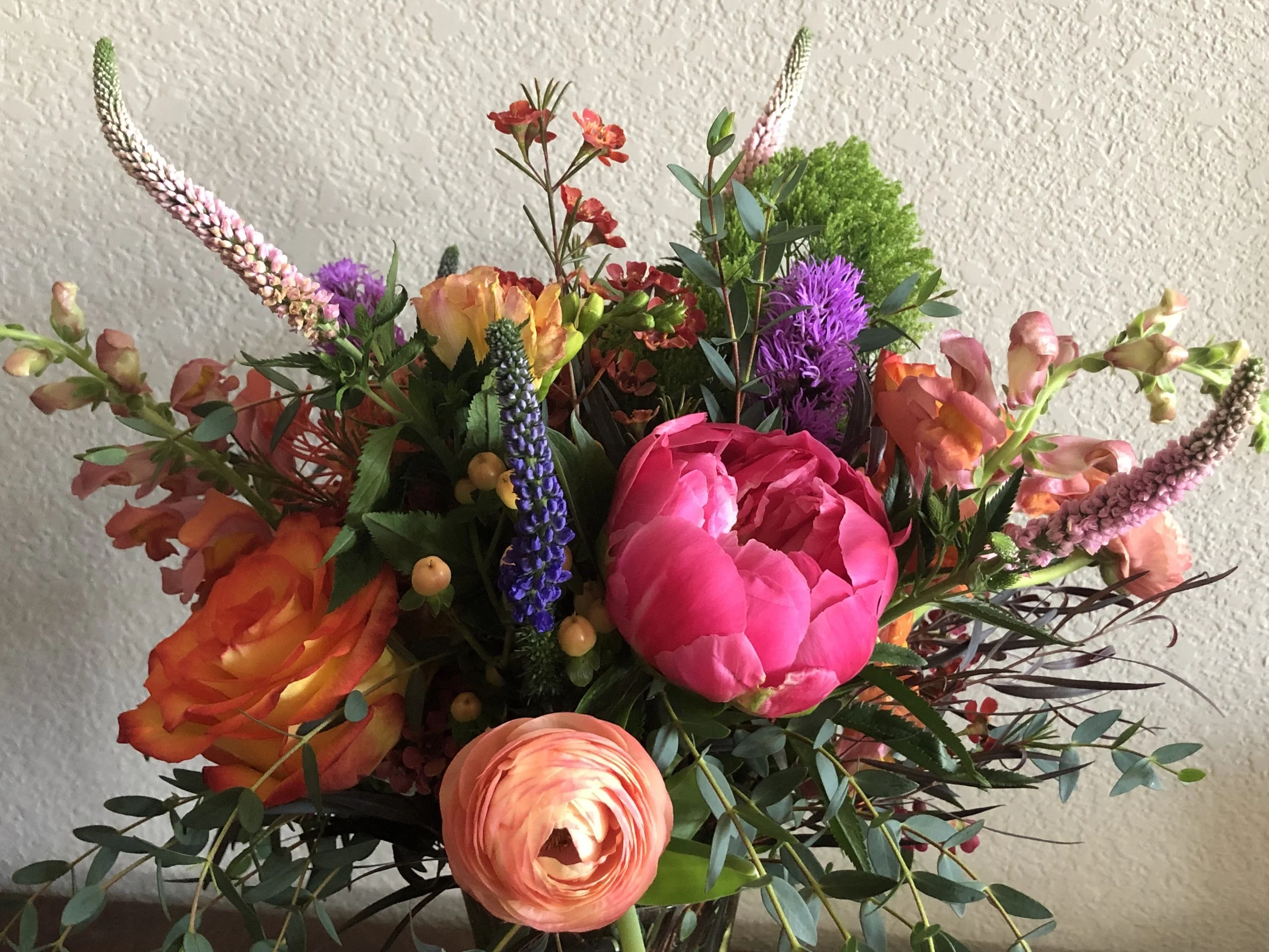 Classical bouquet with pink peonies and salmon ranunculus by Snowdrops & Sage