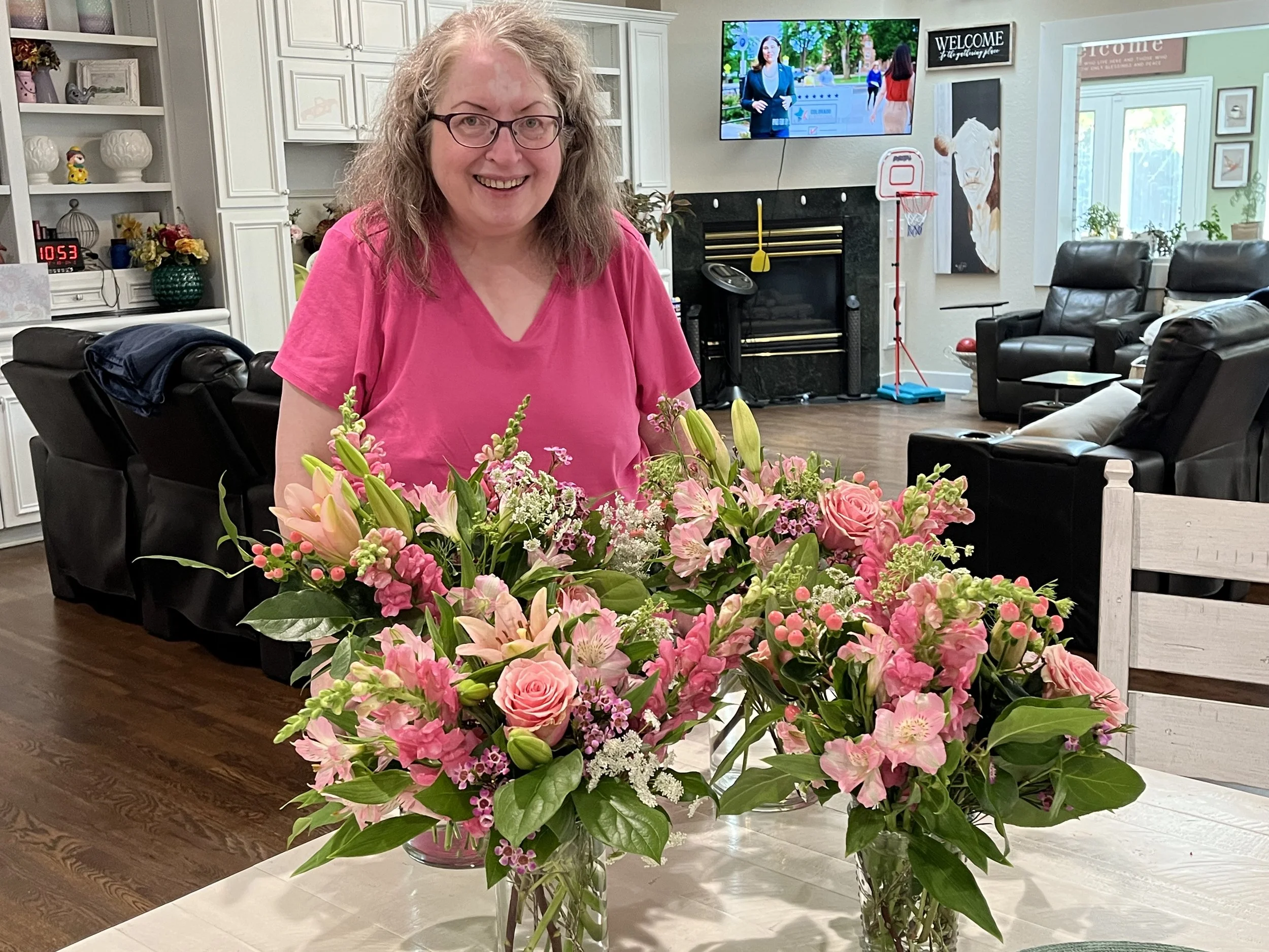 Woman with flower arrangements in a workshop at Snowdrops & Sage in Arvada, CO