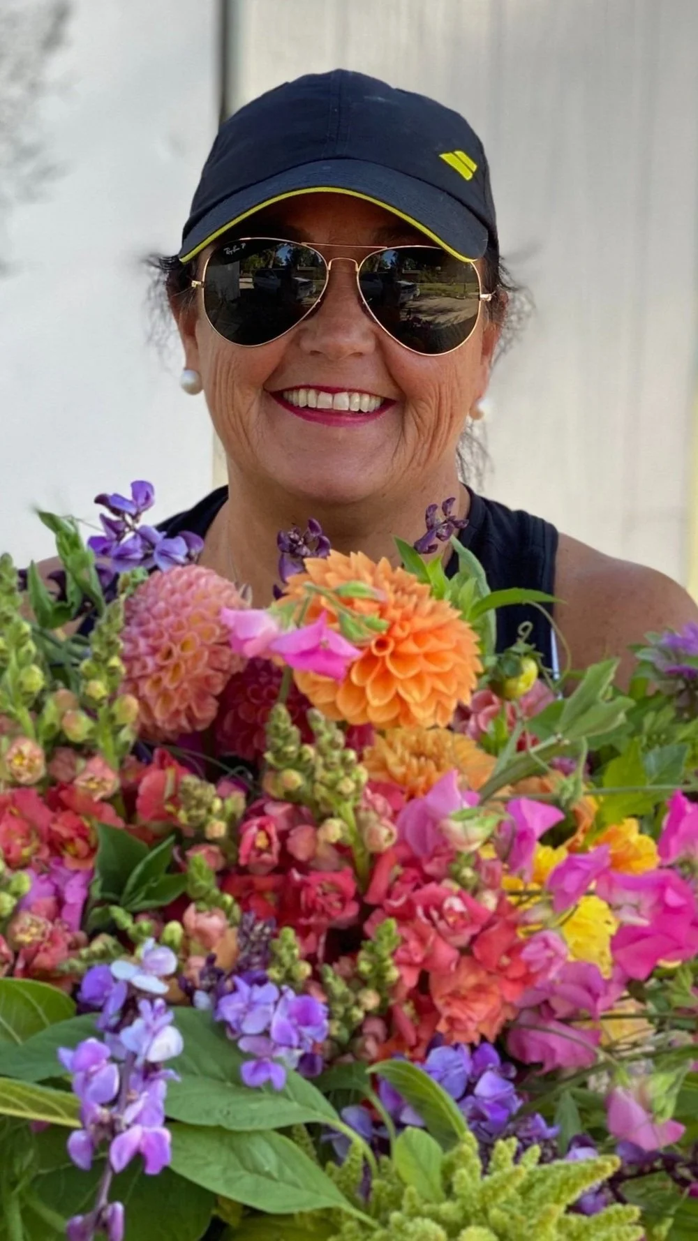 Woman holding a vibrant bouquet of fresh flowers