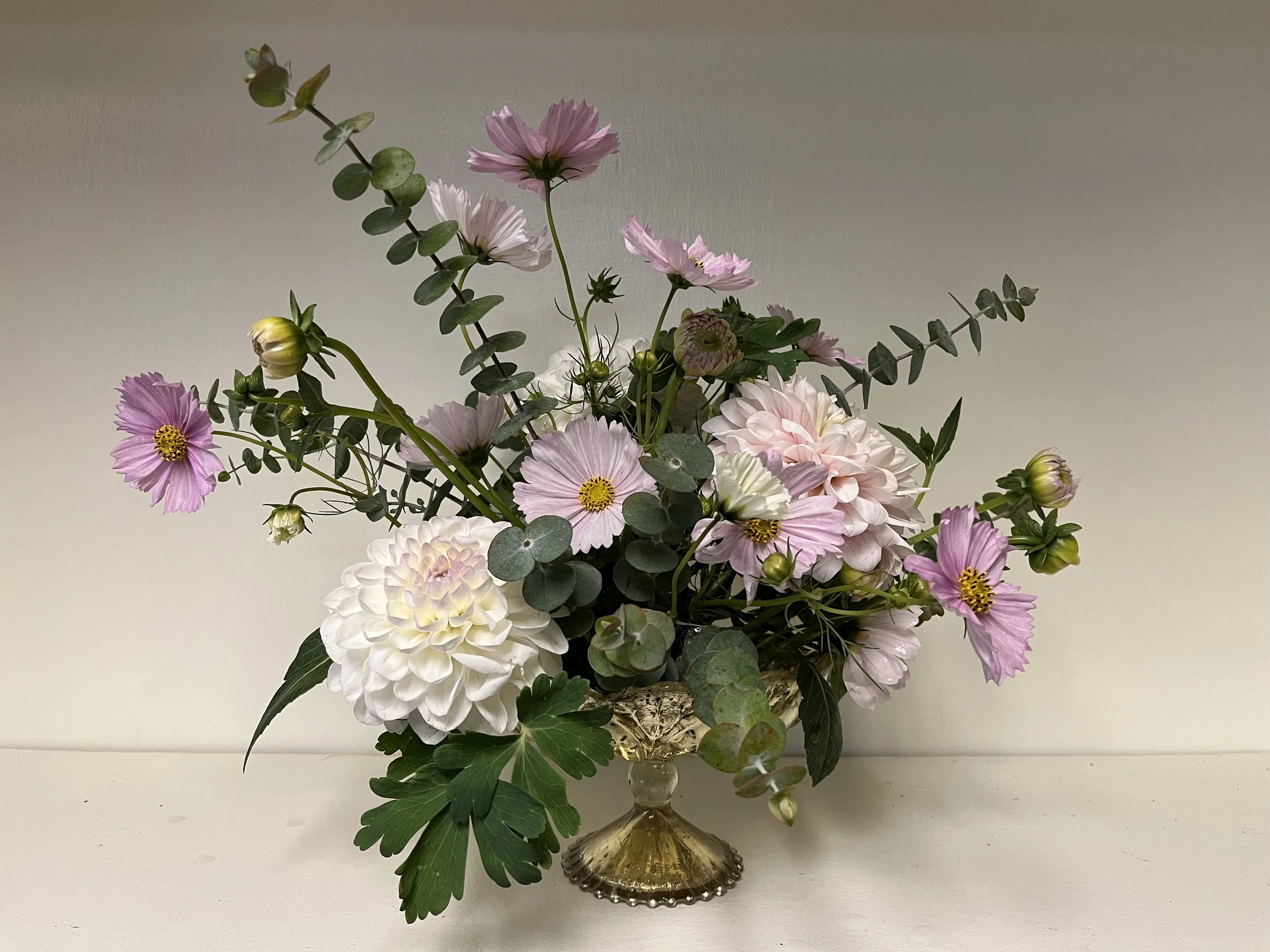 Elegant arrangement with pink cosmos, white dahlias, and eucalyptus by Snowdrops & Sage's in Arvada, CO