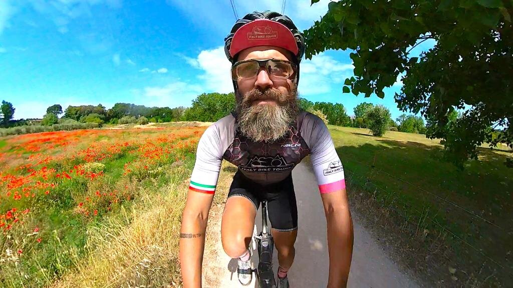Cyclists riding on gravel roads in Italy