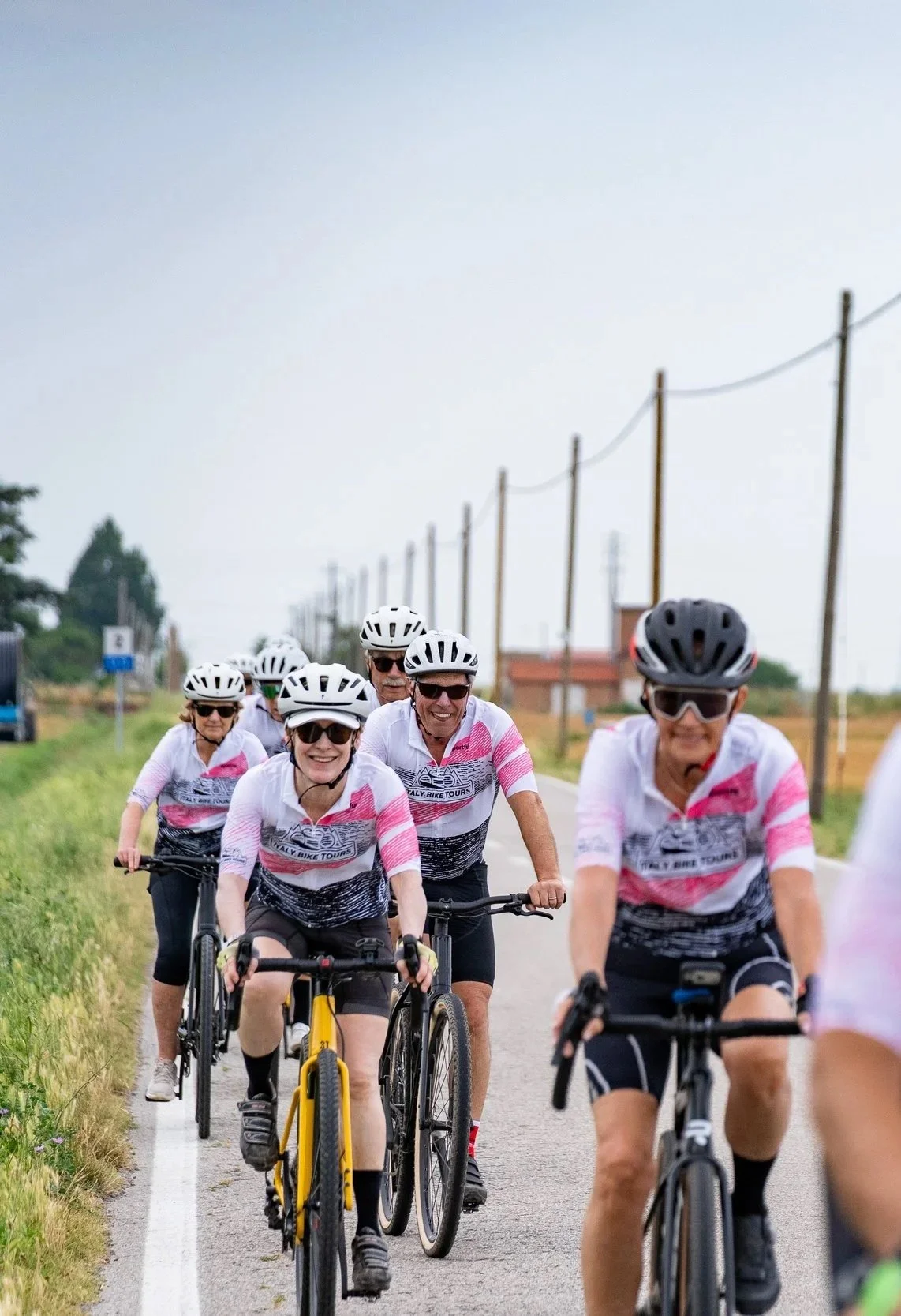 Cyclists riding through the Italian lakes