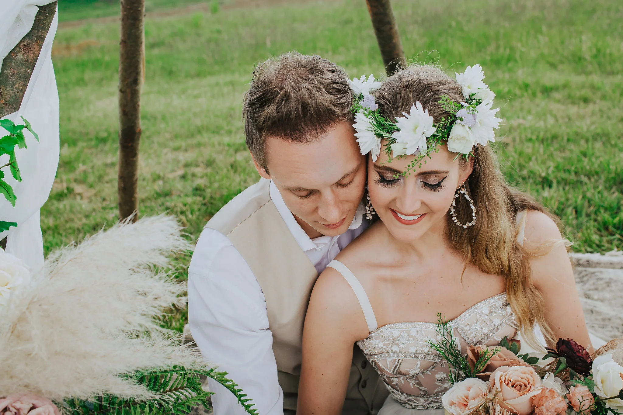 canvas-and-light-white-tipis-outdoor-ceremony-bride-and-groom.jpg