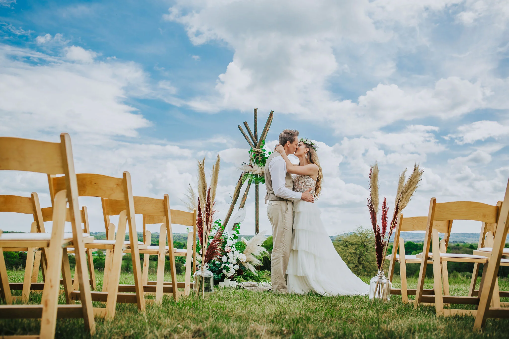 canvas-and-light-white-tipis-outdoor-ceremony.jpg