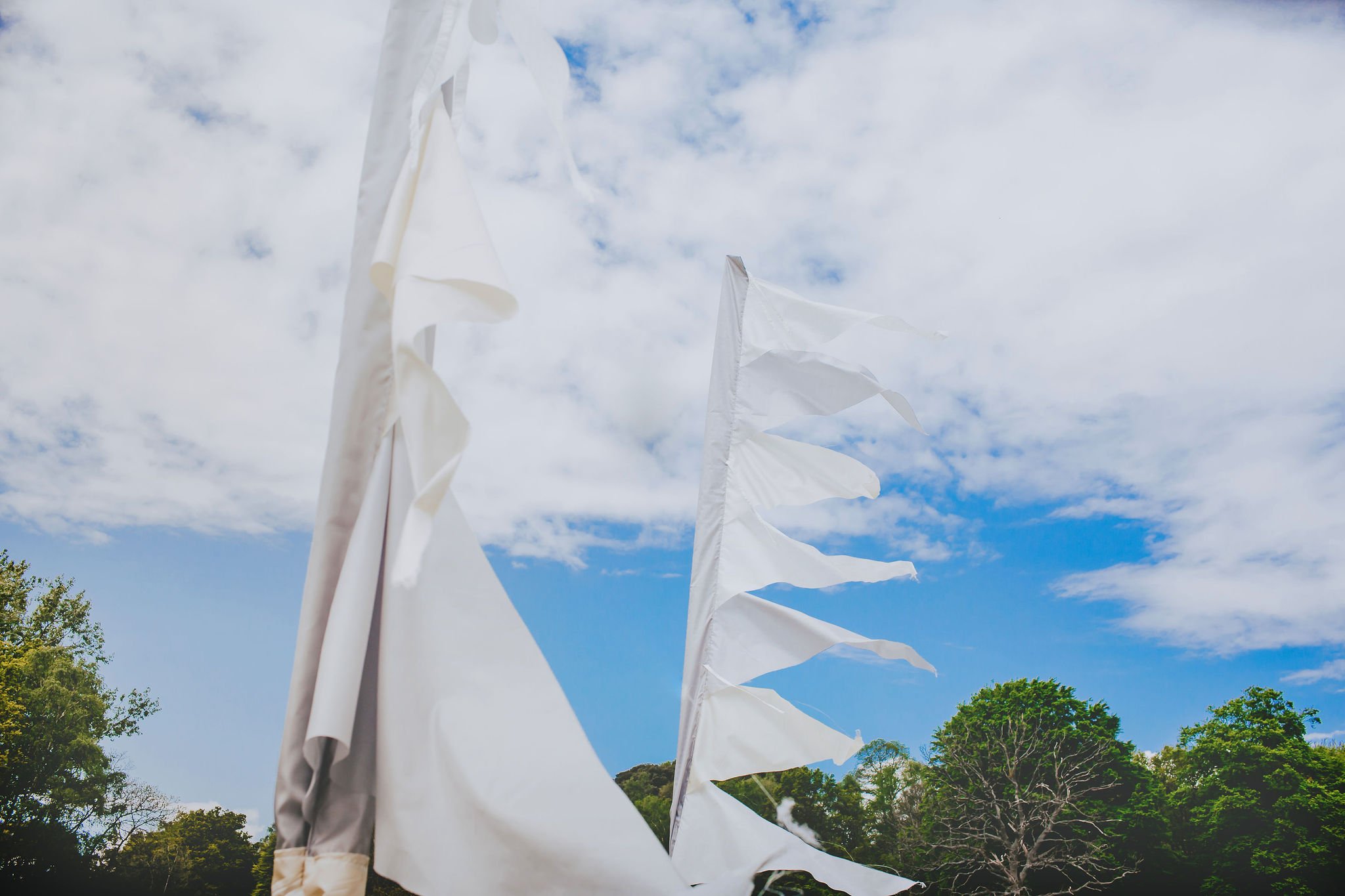 canvas-and-light-white-tipi-hire-festival-flags.jpg