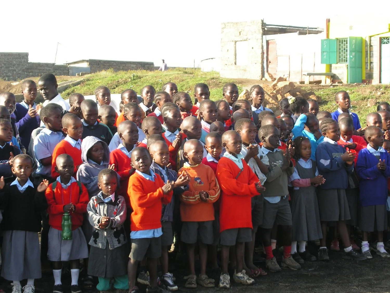 Volunteer Standing With Boys volunteer-standing-with-boys