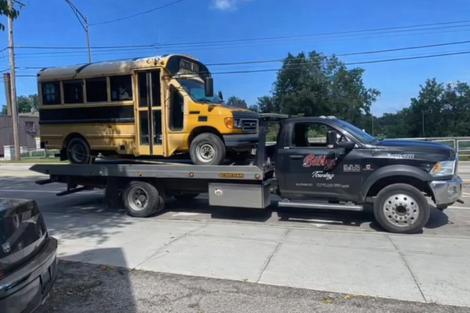 Junk small school bus being taken to the junkyard in Cleveland, OH