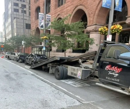 Wrecked cars in Cleveland, OH waiting for tow truck