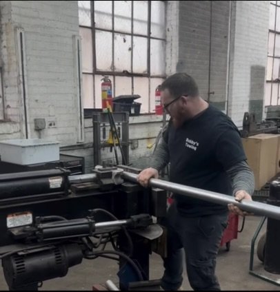Mechanic using an exhaust bender in Cleveland, Ohio