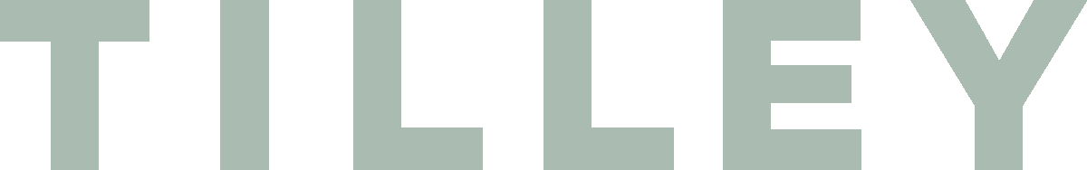 Part of a large sign with the word 'TILLEY' in bold, light-colored letters on a dark background.