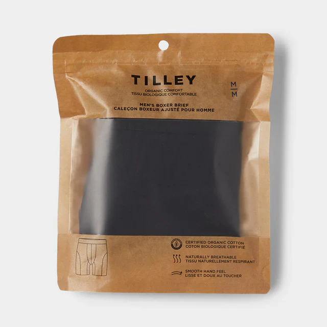Packaging of Tilley men's organic comfort boxer briefs in black with a transparent window, brown top, and clear label with product information.