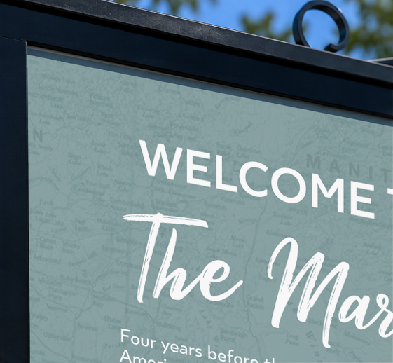 Close-up of a welcome sign with the text 'WELCOME to The Mar...'.