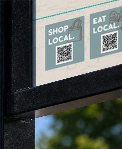 Sign with the text 'Shop Local' and 'Eat Local' along with QR codes.