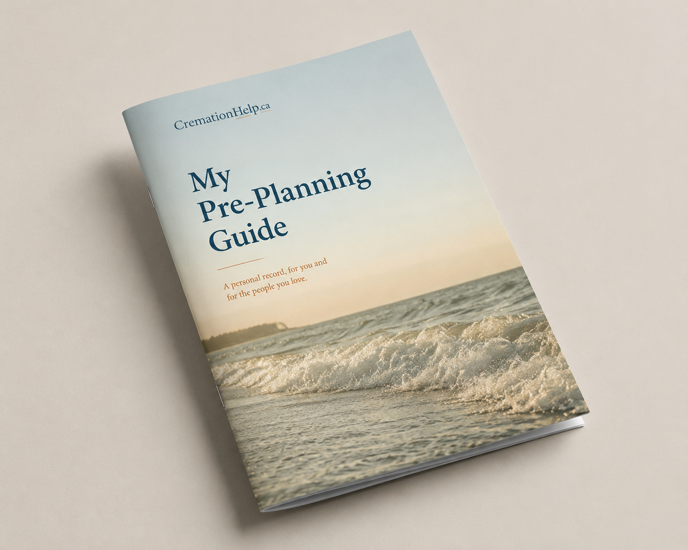 A booklet titled "My Pre-Planning Guide" with a beach scene on the cover, showing waves and a sunset.