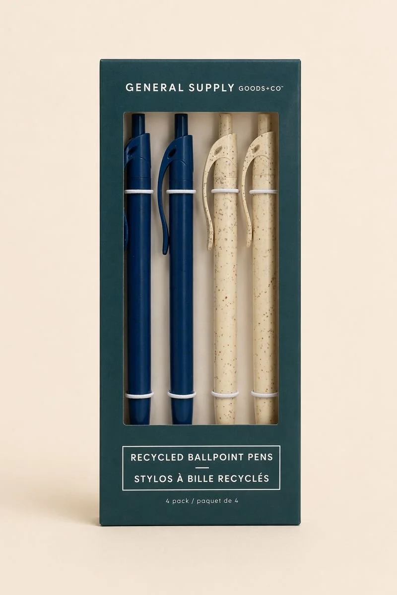 Four recycled ballpoint pens in a box, two in navy blue and two in beige with speckles, labeled as a 4 pack from General Supply Goods + Co.