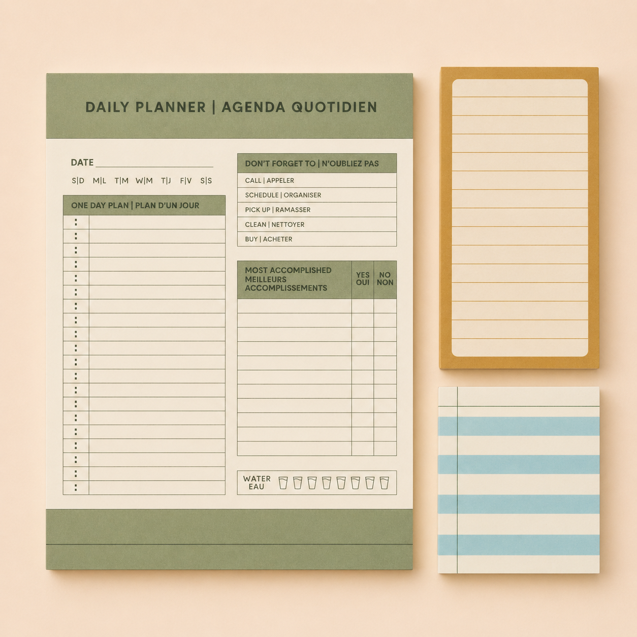 A flat lay of various stationery items including a green and white daily planner with sections for date, one-day plan, don't forget to, and most accomplished, a small tan notepad with lined pages, and a white and blue striped notepad, all arranged on a peach-colored background.