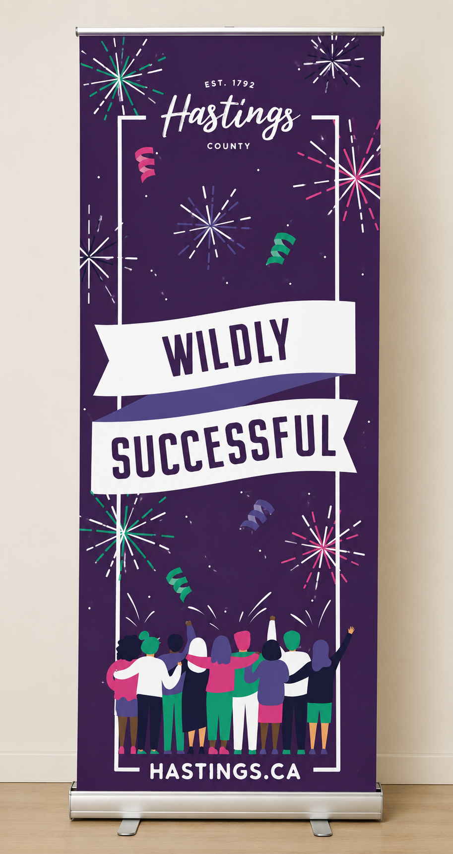A colorful banner with fireworks and people celebrating, promoting Hastings County with the slogan 'Wildly Successful' and the website hastings.ca.