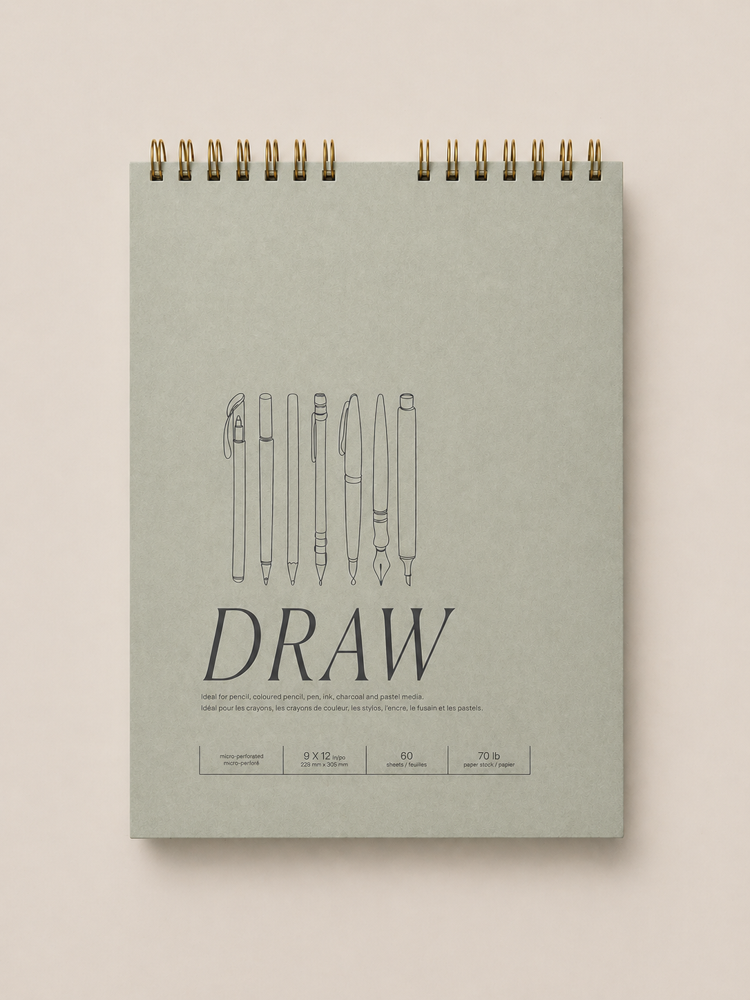 A spiral-bound sketchpad titled 'Draw' with line drawings of various pens and pencils on the cover, placed on a light beige background.