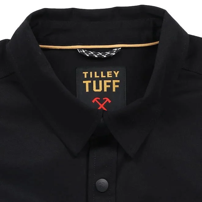 Close-up of a black collared shirt with a label that reads 'TILLEY TUFF' and a red logo below the text.