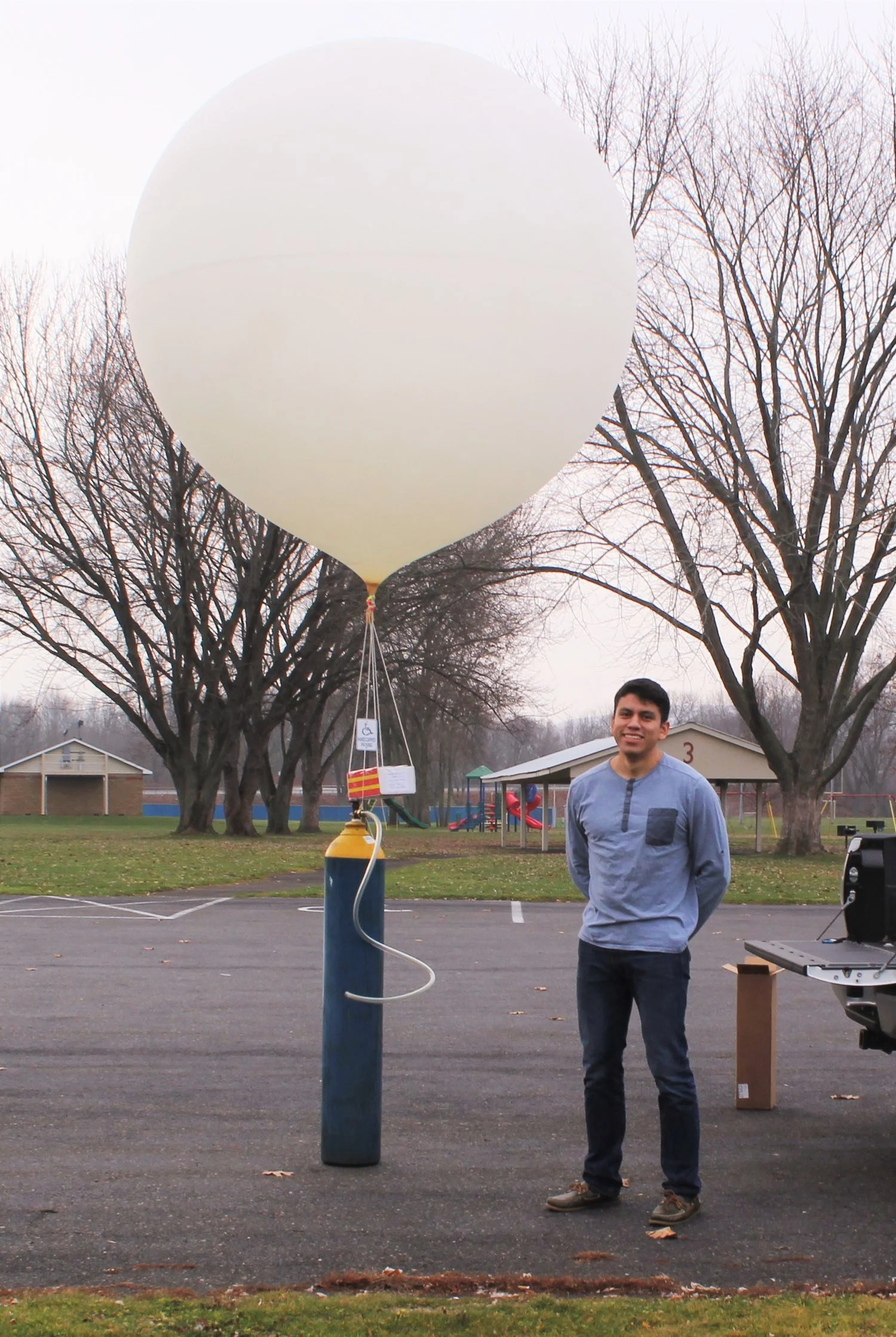 helium tank pose.jpeg