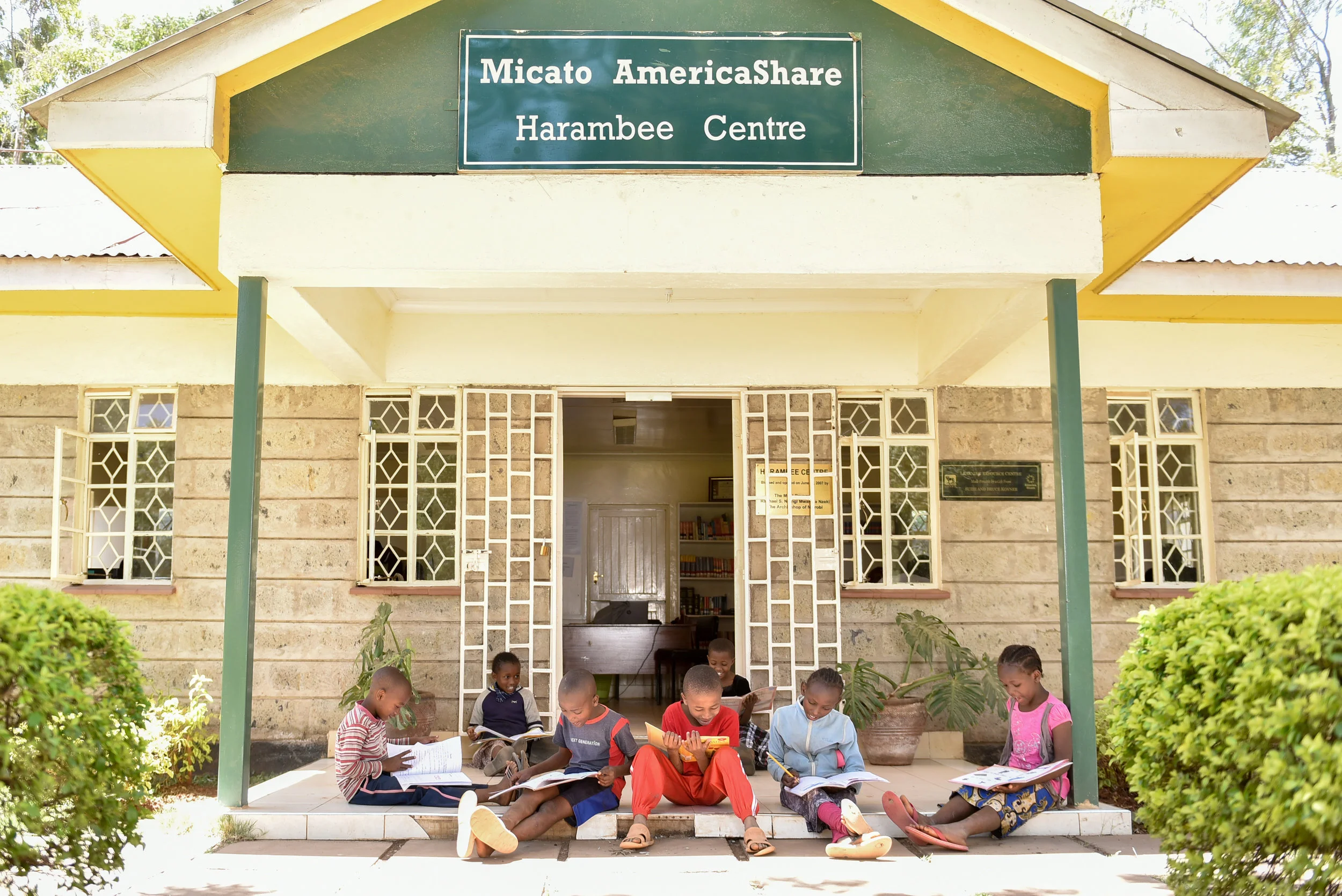 Mission and Vision - group of children in front of harambee center.jpg