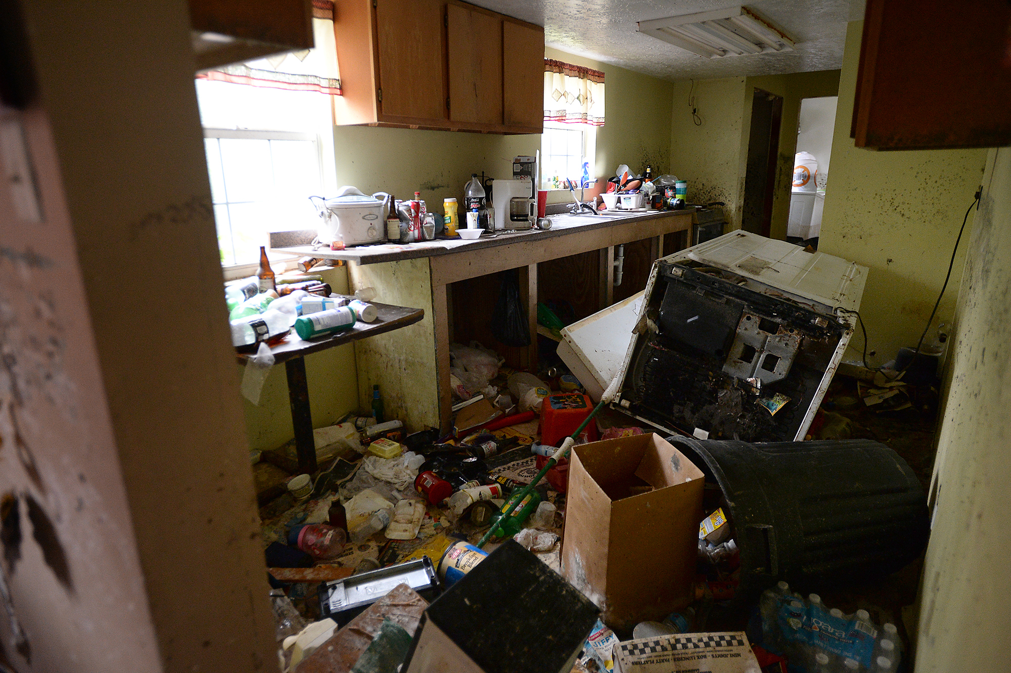  Jennifer and Steven Kaufman's home is filled with flood damaged items that floated throughout the residence as it took on water when Tropical Storm Harvey hit. The several of feet of water has since receded, leaving behind ayers of dirt and quickly 