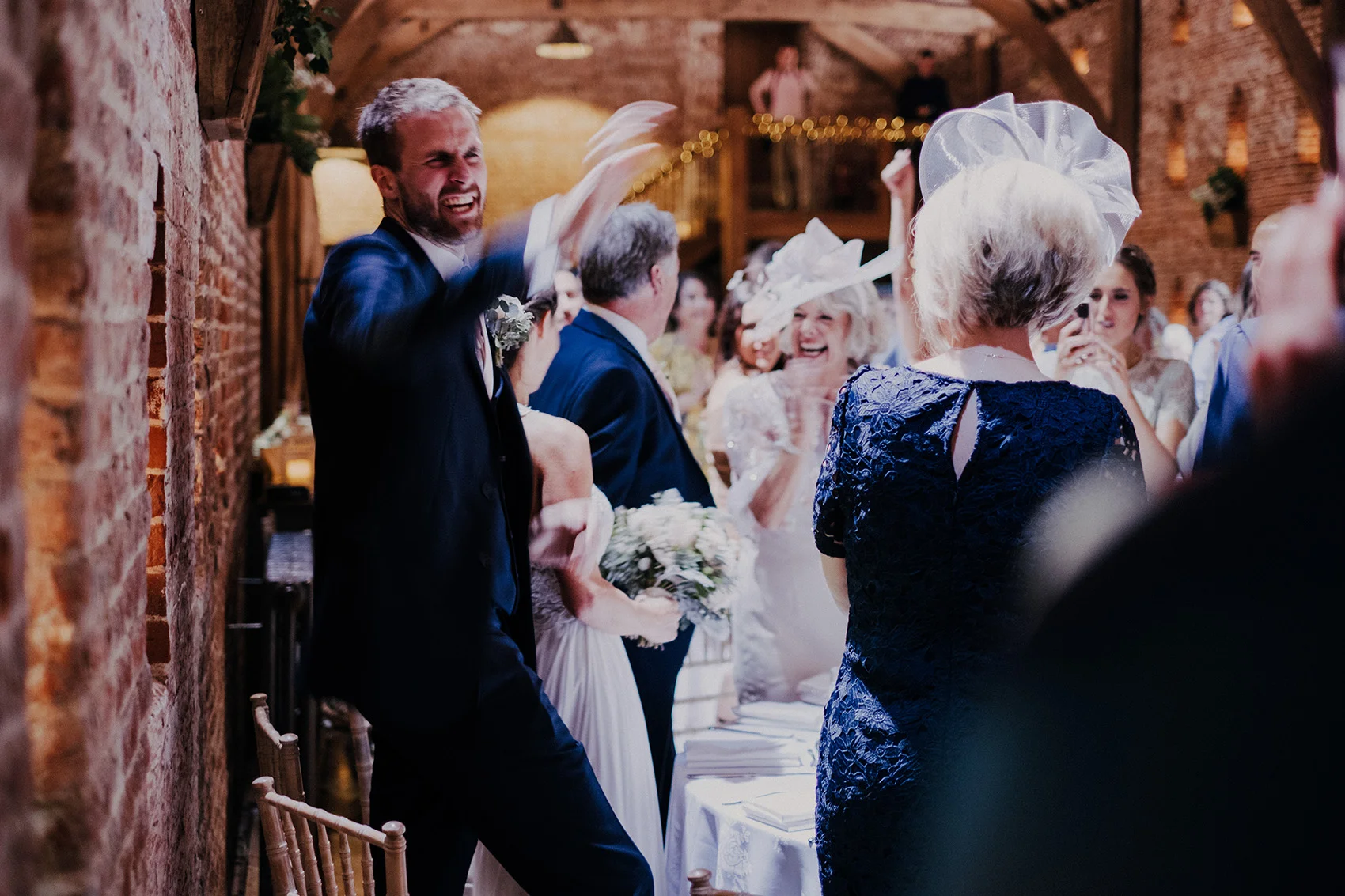 Candid groom shot at Norfolk wedding