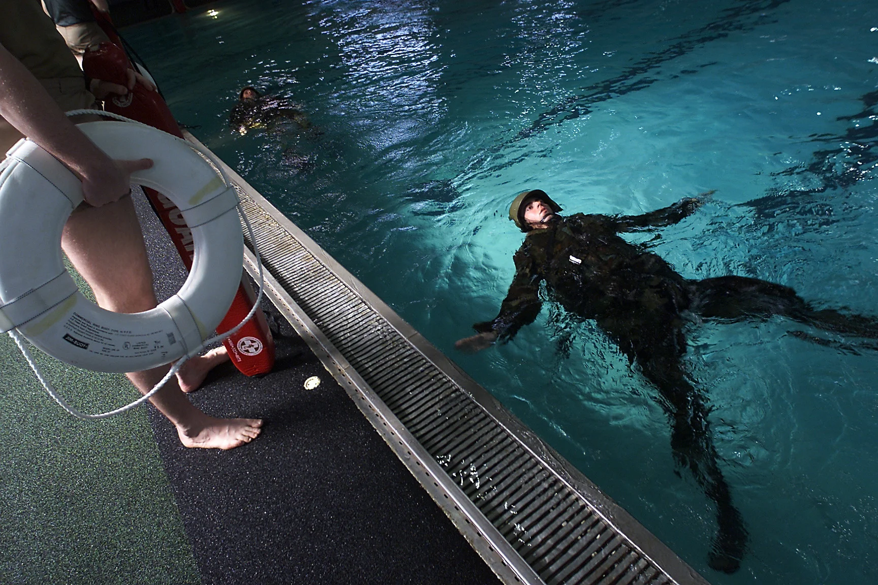 Marine recruits learn to swim in full gear as part of their training. Parris Island, South Carolina