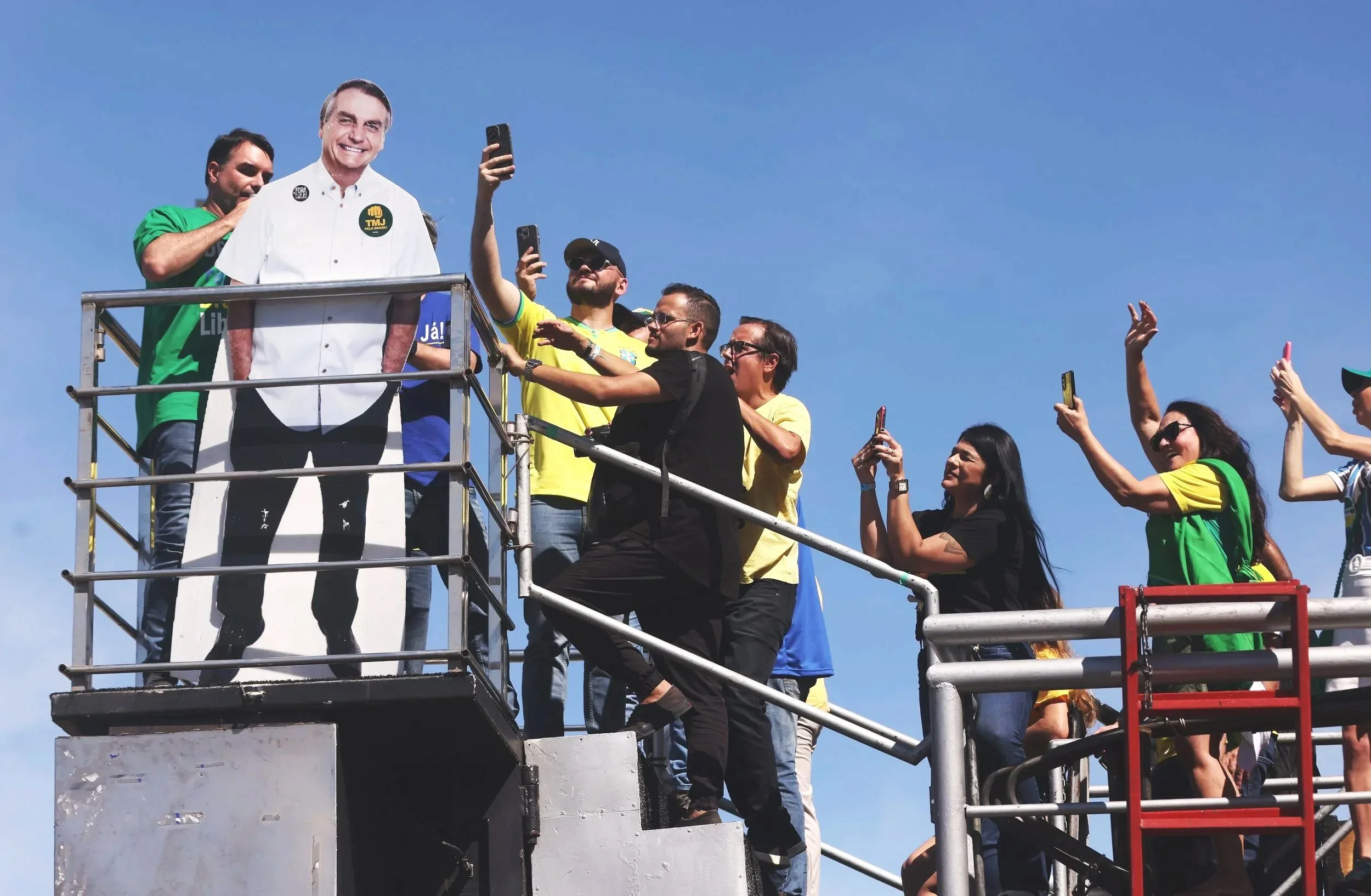 As Jair Bolsonaro’s voice echoed through the crowd, supporters aboard a trio elétrico recorded the moment on their phones, aiming to spread it across social media.