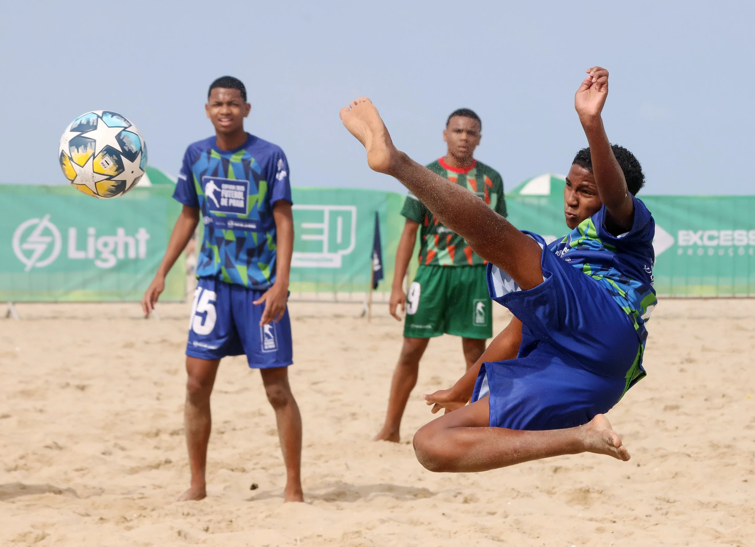 KAYKE FELIPE DOS SANTOS DE OLIVEIRA from Rio das Pedras connects with a Scissor kick vs. Jacarezinho as they battle in the opening round of the prestigious Rio de Futebol de Praia Cup on Copacabana