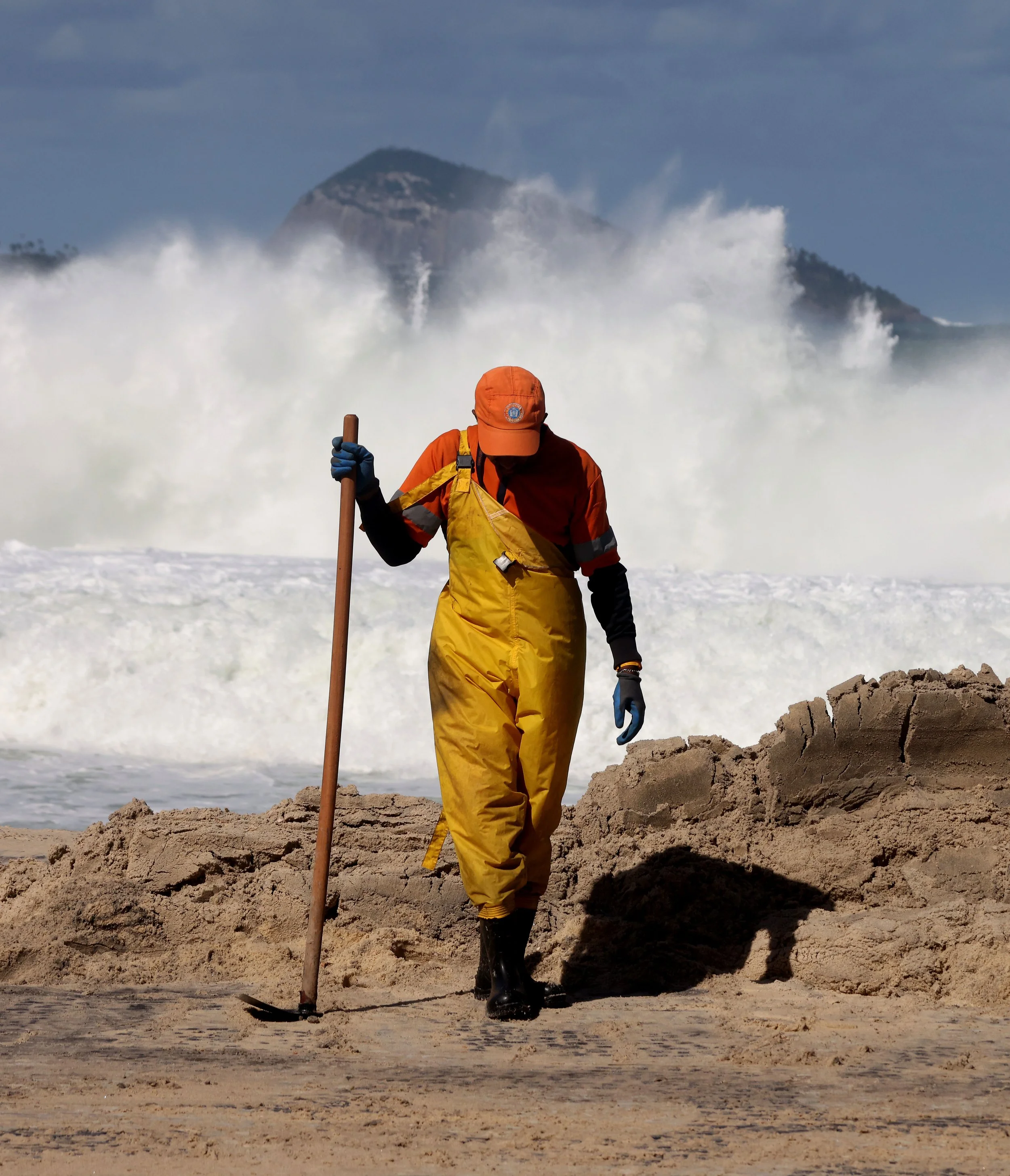 Rio de Janeiro Municipal cleaning crews from Comlurb were dispatched to help clean up the aftermath of a powerful winter storm that sent ocean waves surging over the beach in a rare storm surge event